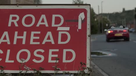 Road-ahead-closed-red-sign-warning-motorists-of-road-works-ahead