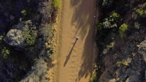 4k-drone-footage-of-a-woman-hiking-through