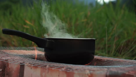 water-boiling-in-a-pot-at-campfire