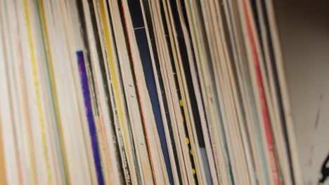 Close-up-old-vinyl-covers-stack.-4K-UHD