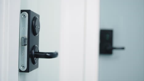 Close-up-of-black-door-handles-for-bathrooms