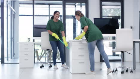 Happy-women-cleaning-an-office-together