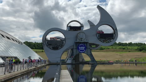 View-of-the-Falkirk-Wheel-turning-as-it-lifts-a-barge-onto-the-canal-above