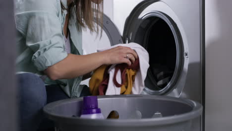 a-young-woman-doing-laundry-at-home