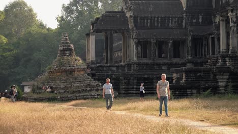 Tourists-Walking-Past-a-Temple-at-Angkor-Wat
