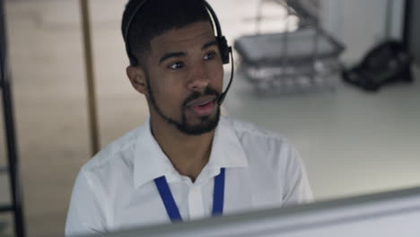 a-confident-young-man-using-a-headset
