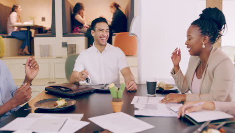 a-group-of-young-coworkers-laughing-as-they