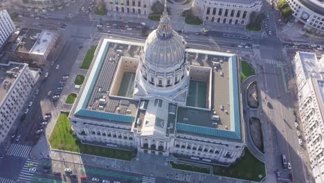 Aerial-view-of-City-Hall-dynamic-shot-of-dome-in-Civic-Center-while-flying-up-at-evening-dusk