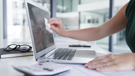 Sanitizer,-wipe-and-woman-cleaning-her-laptop