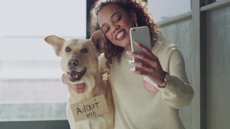 African-woman-taking-a-selfie-with-her-dog