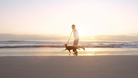 a-man-going-for-a-run-with-his-dog-on-the-beach