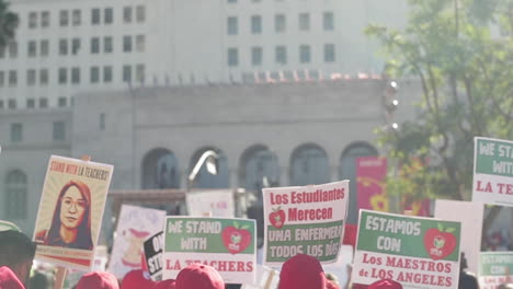 Signs-Twirl-in-the-Air-at-LAUSD-Teacher's-Strike,-Slow-Motion