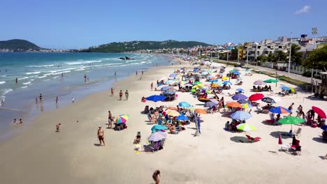 Aerial-shot-of-tourists-enjoying-a-sunny-day-at-Bombinhas-beach