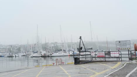 Soft-day-in-Kinsale,-Ireland-with-the-view-over-working-harbour-and-yacht-club-with-high-tide