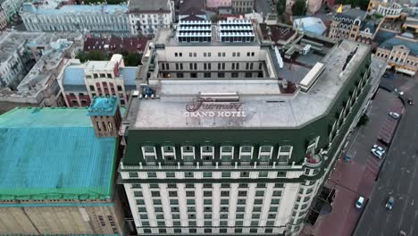 Aerial-tilt-up-reveal-shot-of-the-skyline-of-Kiev-from-the-Grand-Hotel