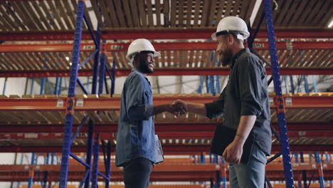 two-engineers-shaking-hands-at-a-construction-site