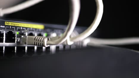 Network-switch-with-ethernet-utp-cables-close-up-panning-shot