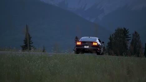 A-Ford-Bullitt-Mustang-muscle-car-seen-driving-on-country-roads-during-blue-hour