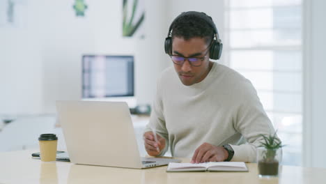 Mixed-race-creative-entrepreneur-using-a-laptop