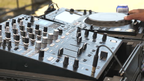 African-DJ-mixing-panning-shot-from-right-to-left-in-slow-motion