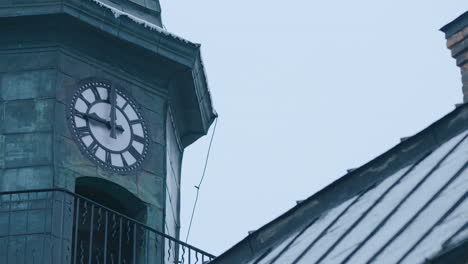 WIDE-SHOT-of-a-clock-tower-as-the-minute-hand-hits-9am