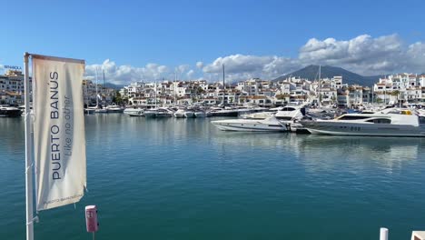 Static-4k-view-of-Puerto-Banus-port-filmed-from-the-pier,-beautiful-view-of-boarts-and-luxury-port-near-Marbella