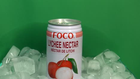 3-3-Tasty-fruity-refreshing-chilled-Foco-Lychee-Drink-with-a-floral-aroma-on-a-360-degree-rotating-filled-ice-bucket-in-front-of-a-green-screen