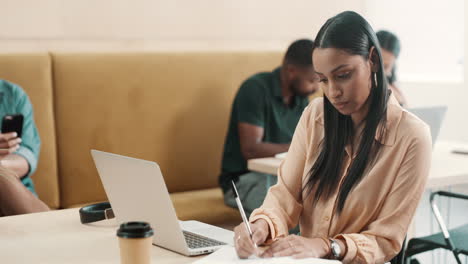 Focused-creative-businesswoman-typing-on-laptop