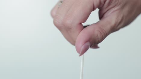 Hand-Rotating-Nasal-Swab-On-Extraction-Tube-For-COVID-19-Testing