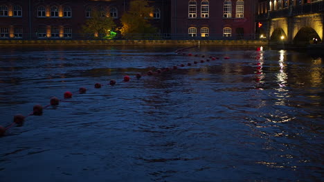 Rope-with-red-buoys-floating-in-the-river