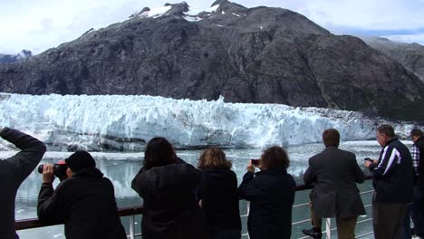 Tourists-enjoying-the-view-of-the-Margerie-Glacier-in-Glacier-Bay-National-Park-Alaska,-aboard-a-cruise-ship