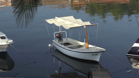 A-Mediterranean-style-boat-docked-in-Vela-Luka-in-Croatia-in-calm-water