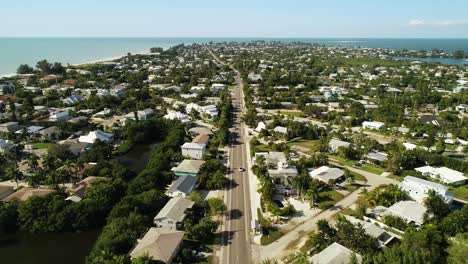 "Anna-Maria-Island,-FL---USA---11-14-2020:-Overhead-drive-through-down-Palm-Drive-in-the-beautiful-beach-town-of-Anna-Maria-Island