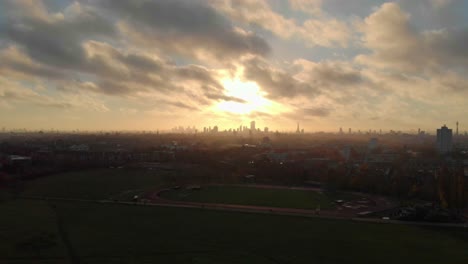 slider-drone-shot-of-beautiful-sunrise-over-London-skyline-from-Hampstead-heath
