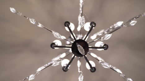 View-from-below-of-contemporary-black-white-crystal-chandelier-light-fixture