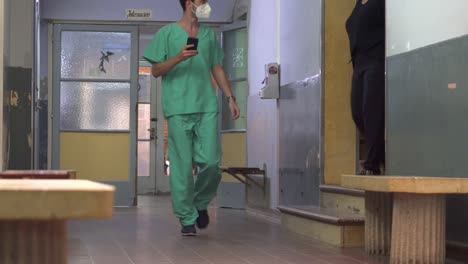 A-doctor-walks-an-hospital-corridor.-handheld