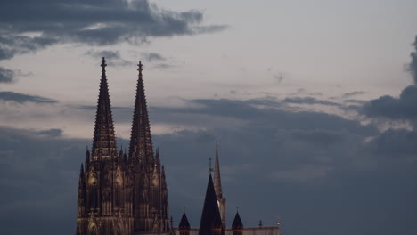 The-top-of-cologne-cathedral-with-nice,-passing-clouds-in-the-background