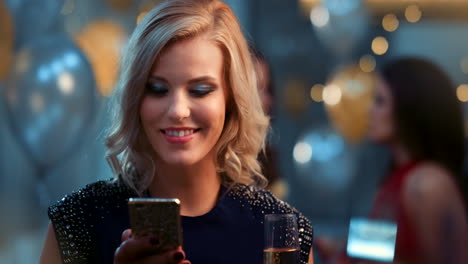 Phone,-champagne-and-woman-at-a-party
