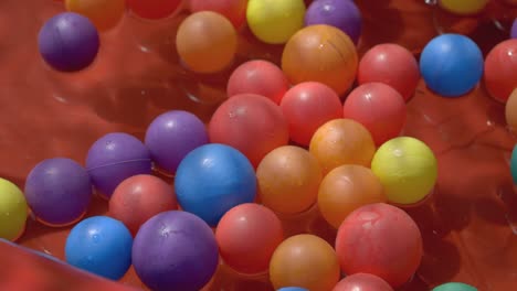 colourful-plastic-balls-in-blow-up-pool