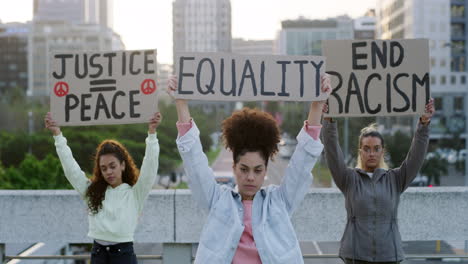 Shot-of-a-three-young-women-protesting-outside