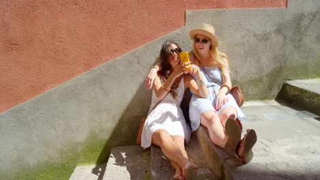Phone,-stairs-and-happy-relax-friends-watch-funny