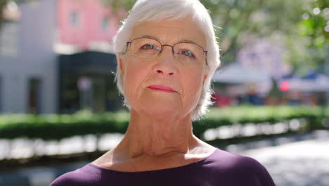 Serious-old-woman-with-glasses-outside