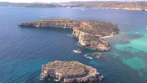 High,-wide-view-of-the-ocean-and-islands-just-off-the-shore-of-Comino,-Malta-near-Blue-Lagoon