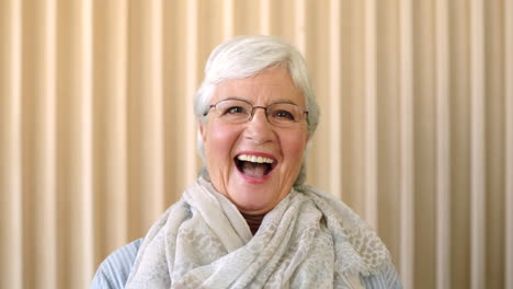 Portrait-of-a-laughing-older-woman-looking-happy