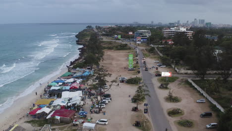 View-of-Coco-beach-with-local-seaside-restaurants-and-main-road-with-cars-passing-by-in-Dar-es-Salaam-city