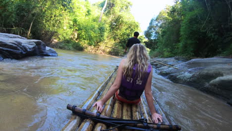 blonde-girl-bamboo-rafting-in-jungle-river-of-Chiang-Mai-river-in-Thailand-Asia-in-2