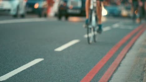 Closeup-of-a-person-cycling-through-a-busy-city