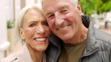 Portrait-of-loving-senior-couple-showing-affection