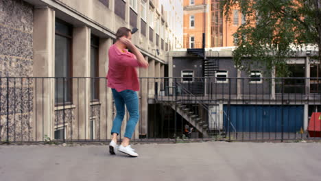 a-young-man-dancing-against-an-urban-background