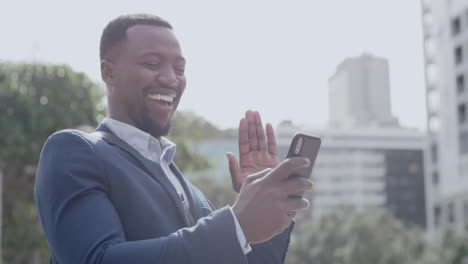 Excited-black-business-man-laughing-on-video-call